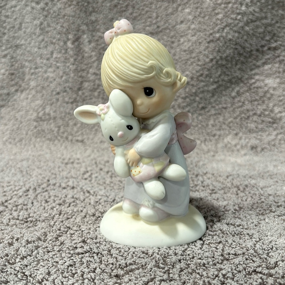 Precious moment, girl with bunny figurine